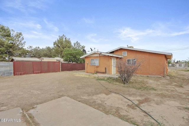 12365 Stubbs Dr, San Elizario, TX 79849 - rear view of property featuring fence, a patio area, and stucco siding