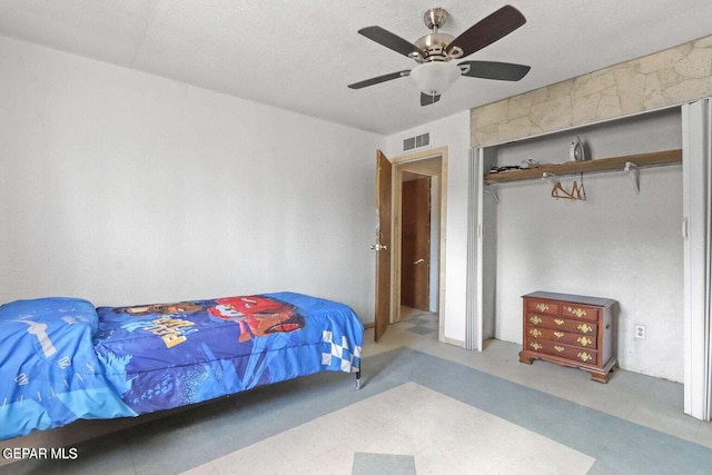 12365 Stubbs Dr, San Elizario, TX 79849 - bedroom with visible vents, a textured ceiling, ceiling fan, and tile patterned floors