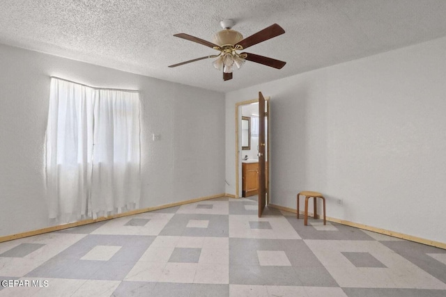 12365 Stubbs Dr, San Elizario, TX 79849 - unfurnished room with baseboards, a textured ceiling, ceiling fan, and tile patterned floors