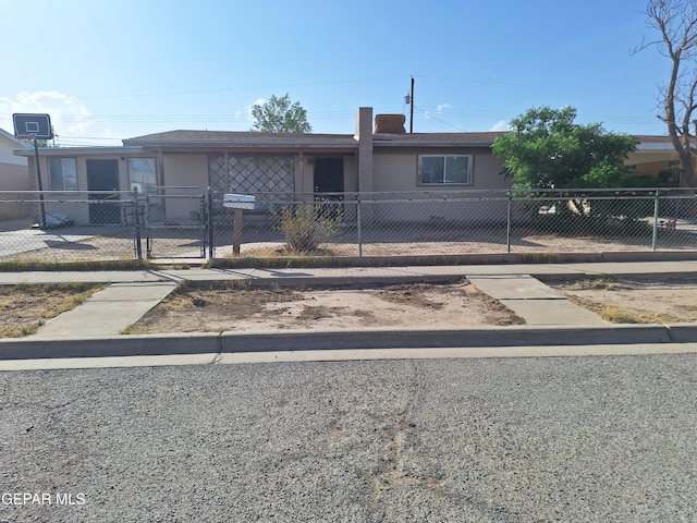 309 Ben Swain Dr, El Paso, TX 79905 - single story home with a fenced front yard and a gate
