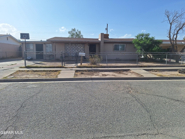 309 Ben Swain Dr, El Paso, TX 79905 - ranch-style house featuring a fenced front yard, a gate, and a chimney