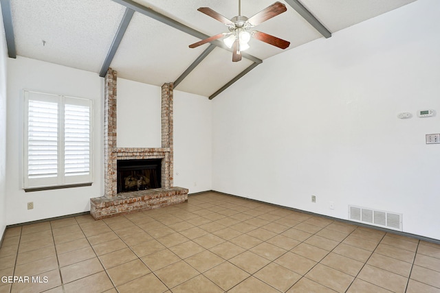unfurnished living room featuring visible vents, a fireplace, lofted ceiling with beams, a ceiling fan, and light tile patterned floors