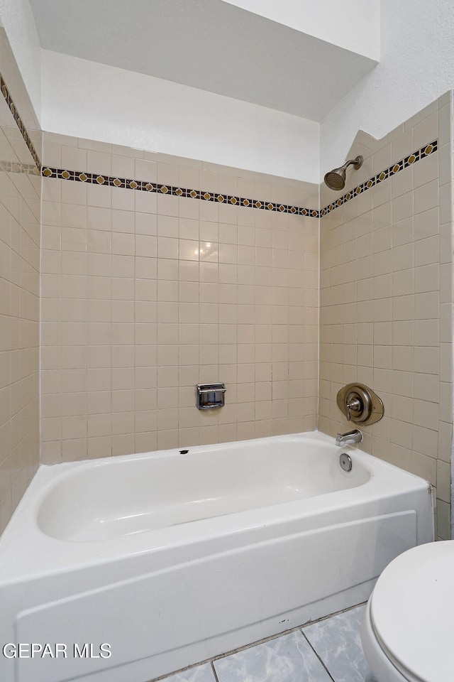 bathroom with shower / bath combination and toilet