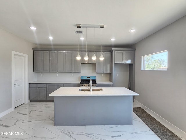 478 Sylvia Ct, Socorro, TX 79927 - kitchen featuring gray cabinets, light marble finish floors, recessed lighting, and light countertops