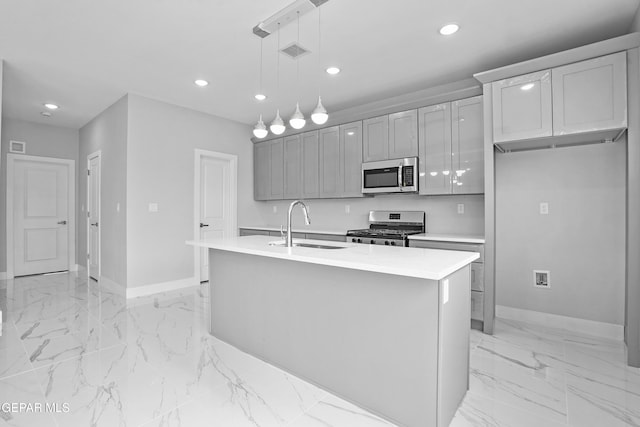 478 Sylvia Ct, Socorro, TX 79927 - kitchen with appliances with stainless steel finishes, light marble finish floors, recessed lighting, gray cabinets, and light countertops