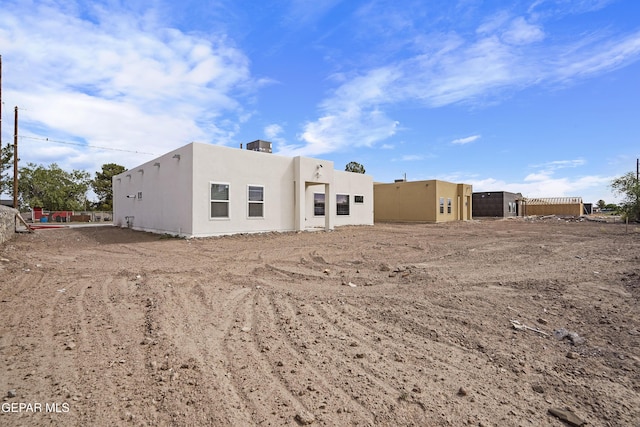 478 Sylvia Ct, Socorro, TX 79927 - rear view of house with stucco siding