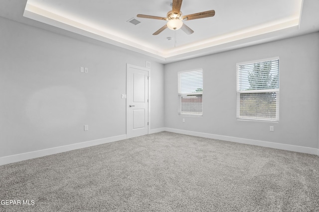 478 Sylvia Ct, Socorro, TX 79927 - carpeted empty room featuring a raised ceiling and a ceiling fan
