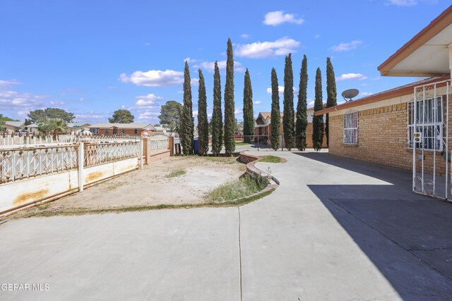9232 Morelia Rd, El Paso, TX 79907 - view of yard featuring fence, a patio area, and a residential view