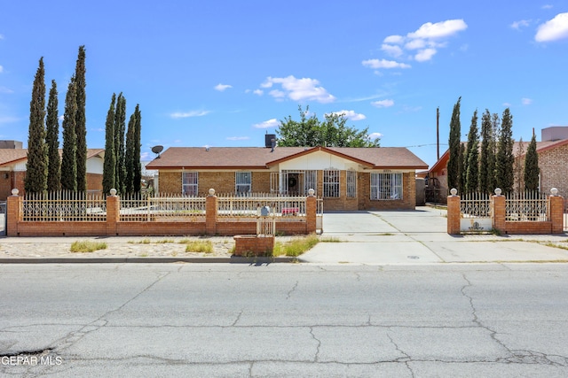 9232 Morelia Rd, El Paso, TX 79907 - ranch-style home with concrete driveway and a fenced front yard