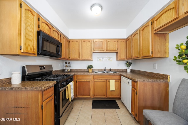 9232 Morelia Rd, El Paso, TX 79907 - kitchen with a sink, dark countertops, black microwave, gas stove, and white dishwasher