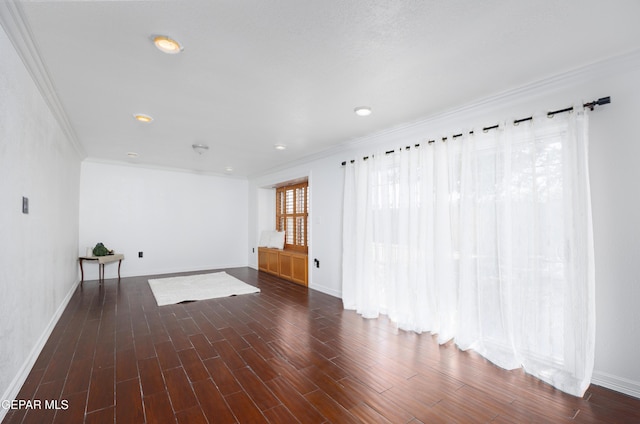 9232 Morelia Rd, El Paso, TX 79907 - unfurnished living room with baseboards, crown molding, and wood finished floors