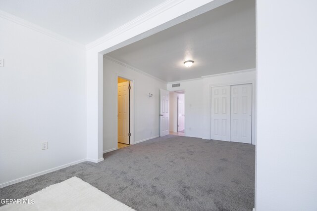 9232 Morelia Rd, El Paso, TX 79907 - unfurnished room featuring ornamental molding, carpet flooring, visible vents, and baseboards