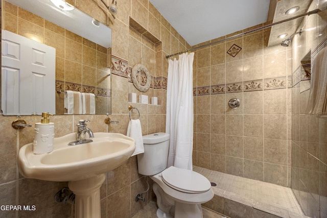 9232 Morelia Rd, El Paso, TX 79907 - full bathroom with tile walls, toilet, tasteful backsplash, and tiled shower
