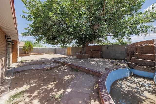 9232 Morelia Rd, El Paso, TX 79907 - view of yard featuring a patio and a fenced backyard