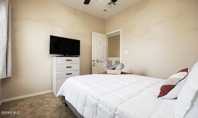 carpeted bedroom with baseboards, a ceiling fan, and visible vents
