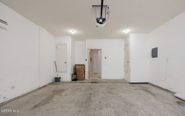 garage featuring a garage door opener and electric panel