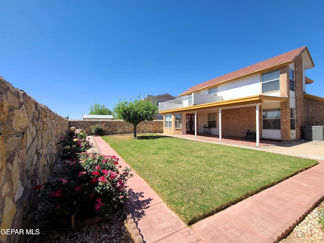 10812 Sandy Koufax Dr, El Paso, TX 79924 - view of yard featuring a fenced backyard, a patio area, and central air condition unit