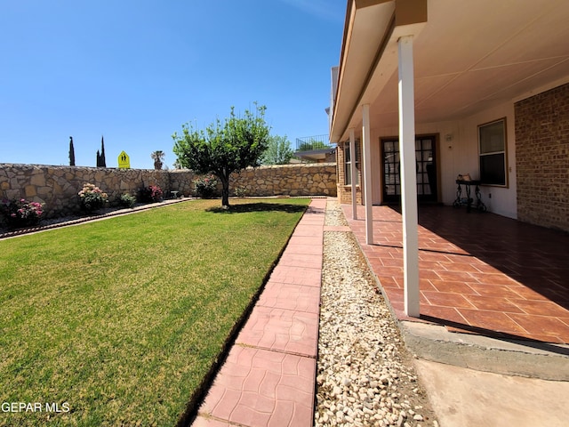 10812 Sandy Koufax Dr, El Paso, TX 79924 - view of yard featuring a patio and a fenced backyard