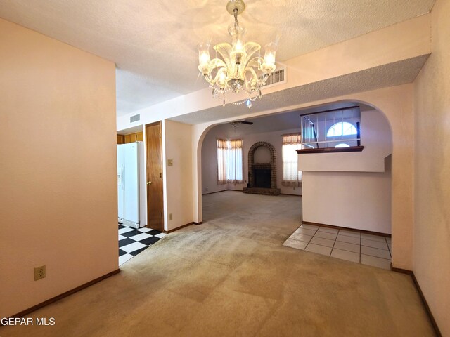10812 Sandy Koufax Dr, El Paso, TX 79924 - hallway featuring an inviting chandelier, carpet floors, arched walkways, baseboards, and visible vents