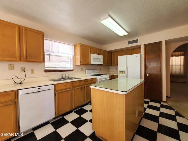 10812 Sandy Koufax Dr, El Paso, TX 79924 - kitchen featuring white appliances, visible vents, a sink, and light floors