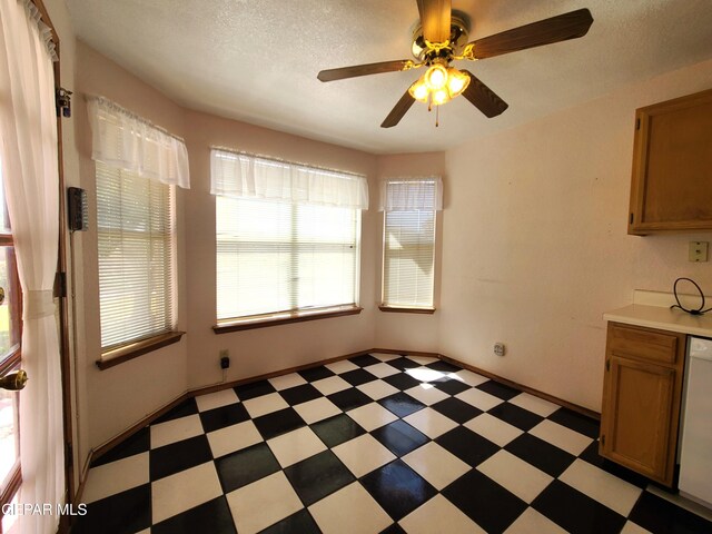 10812 Sandy Koufax Dr, El Paso, TX 79924 - unfurnished dining area featuring a textured ceiling, light floors, and ceiling fan