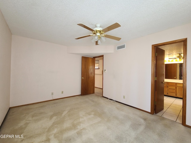 10812 Sandy Koufax Dr, El Paso, TX 79924 - unfurnished bedroom featuring visible vents, a textured ceiling, baseboards, and light colored carpet