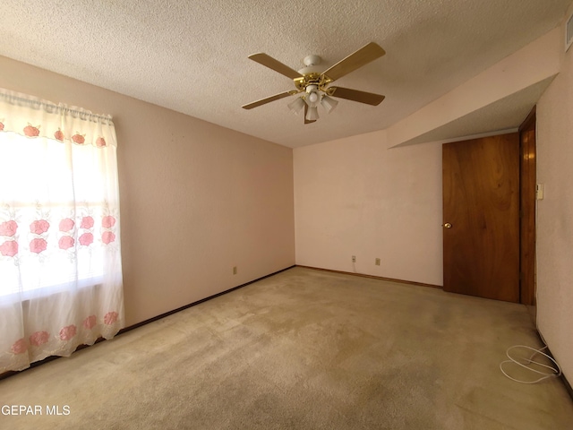 10812 Sandy Koufax Dr, El Paso, TX 79924 - empty room featuring light colored carpet, a textured ceiling, ceiling fan, and visible vents