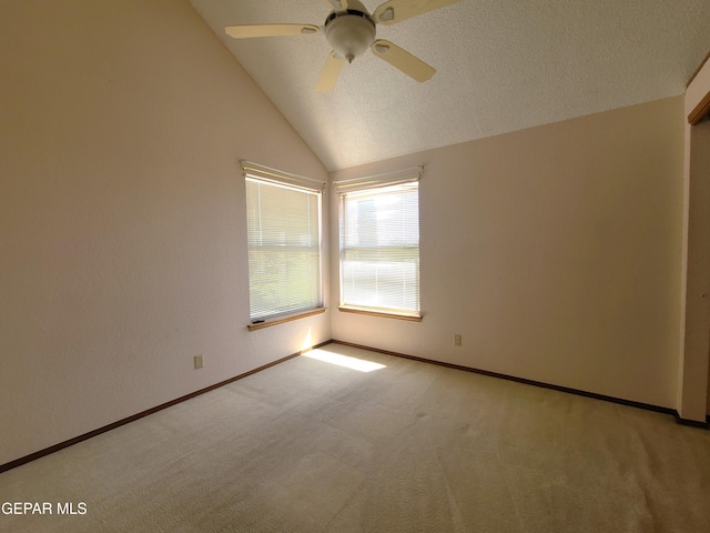 10812 Sandy Koufax Dr, El Paso, TX 79924 - empty room featuring baseboards, a ceiling fan, vaulted ceiling, and light carpet