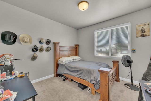 carpeted bedroom featuring baseboards
