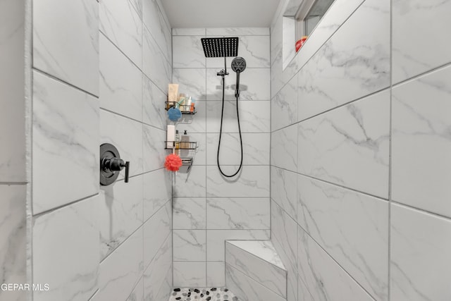 bathroom featuring tiled shower