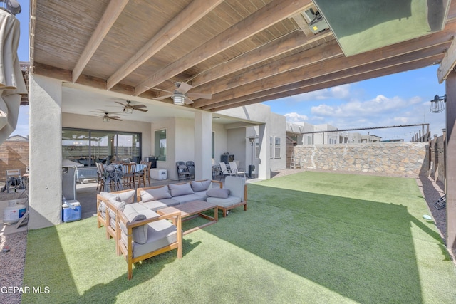 view of patio featuring a fenced backyard, a ceiling fan, and outdoor dining space