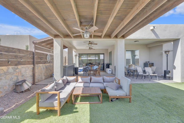 view of patio with fence, an outdoor living space, a ceiling fan, and outdoor dining space