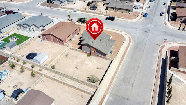 birds eye view of property with a residential view