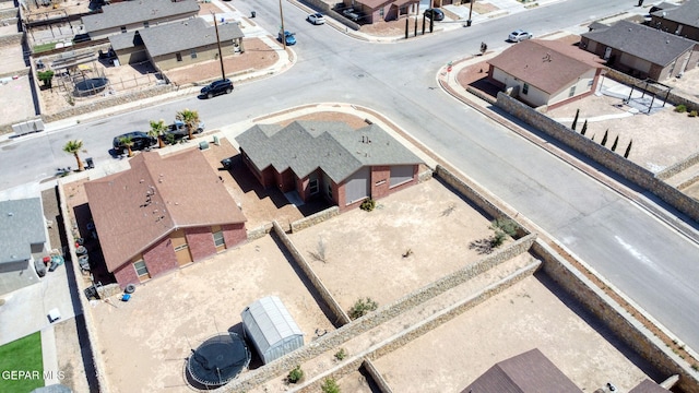 birds eye view of property with a residential view