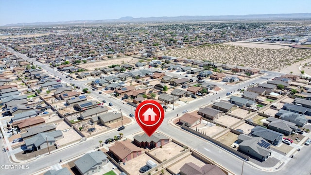 drone / aerial view with a residential view and a mountain view