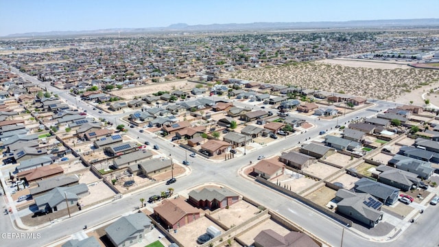 aerial view featuring a mountain view and a residential view