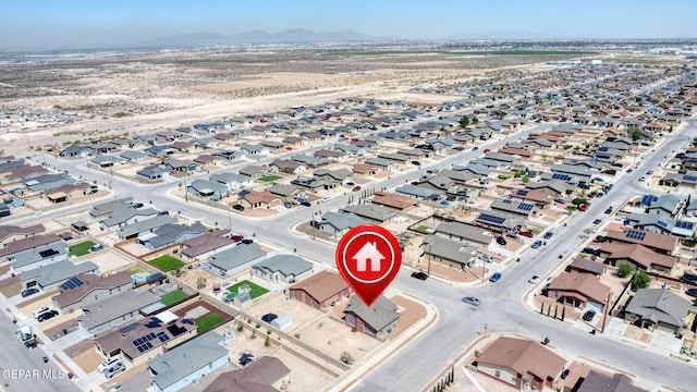 drone / aerial view featuring a mountain view and a residential view