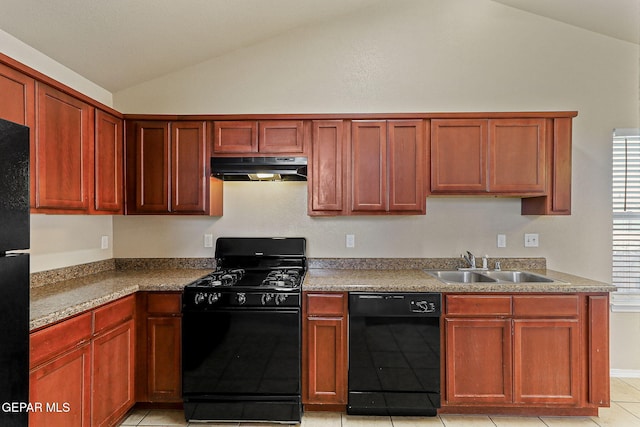 kitchen with a sink, light tile patterned floors, black appliances, lofted ceiling, and under cabinet range hood