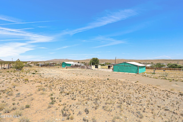 19201 Phillip Bazaar, El Paso, TX 79938 - view of yard with an outbuilding, fence, a mountain view, an outdoor structure, and a rural view