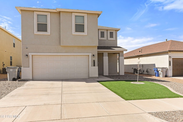traditional home featuring concrete driveway, a garage, a front yard, and stucco siding