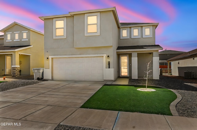 traditional home with a garage, stucco siding, concrete driveway, and cooling unit