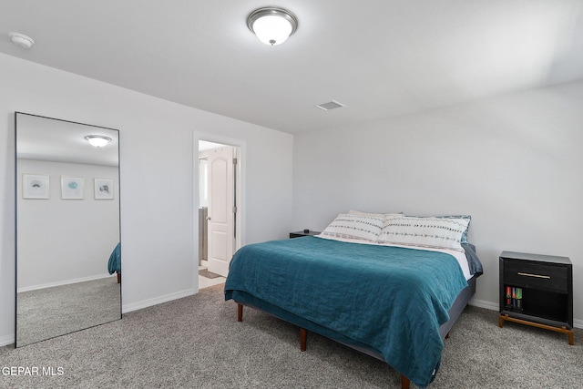 bedroom featuring visible vents, carpet, and baseboards