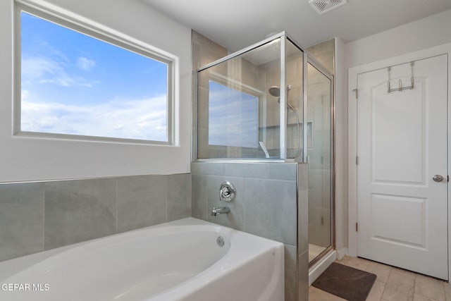 full bath featuring visible vents, a bath, and a stall shower