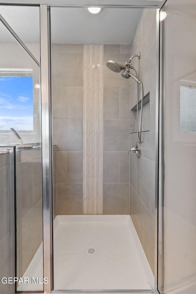 bathroom featuring a stall shower