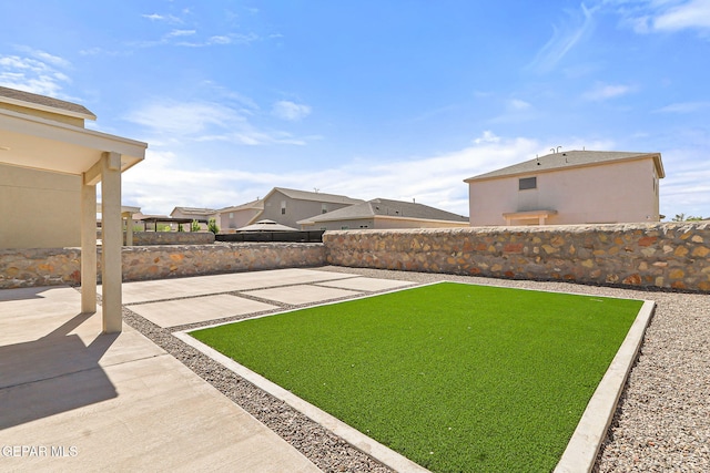 view of yard featuring a fenced backyard and a patio area