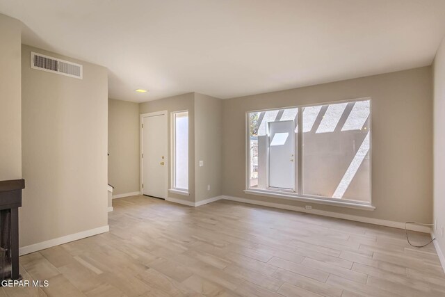 1721 Villa Santos Cir, El Paso, TX 79935 - unfurnished room featuring visible vents, baseboards, and wood finished floors
