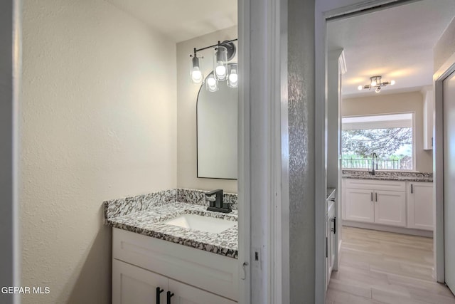1721 Villa Santos Cir, El Paso, TX 79935 - bathroom with vanity and a textured wall