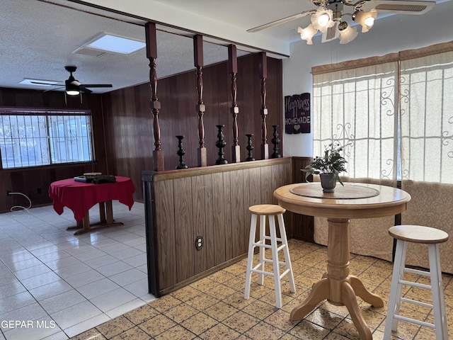 10304 Blackwood Ave, El Paso, TX 79925 - wine room with a ceiling fan and wooden walls