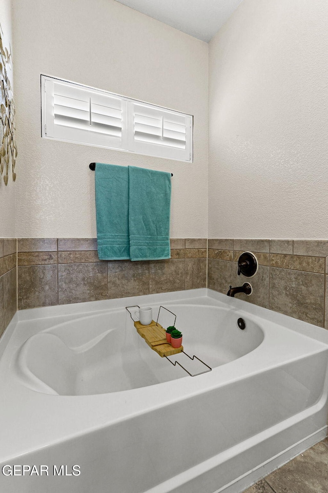 full bathroom featuring a bath