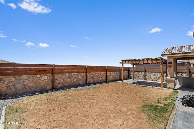 view of yard featuring a patio, a fenced backyard, and a pergola